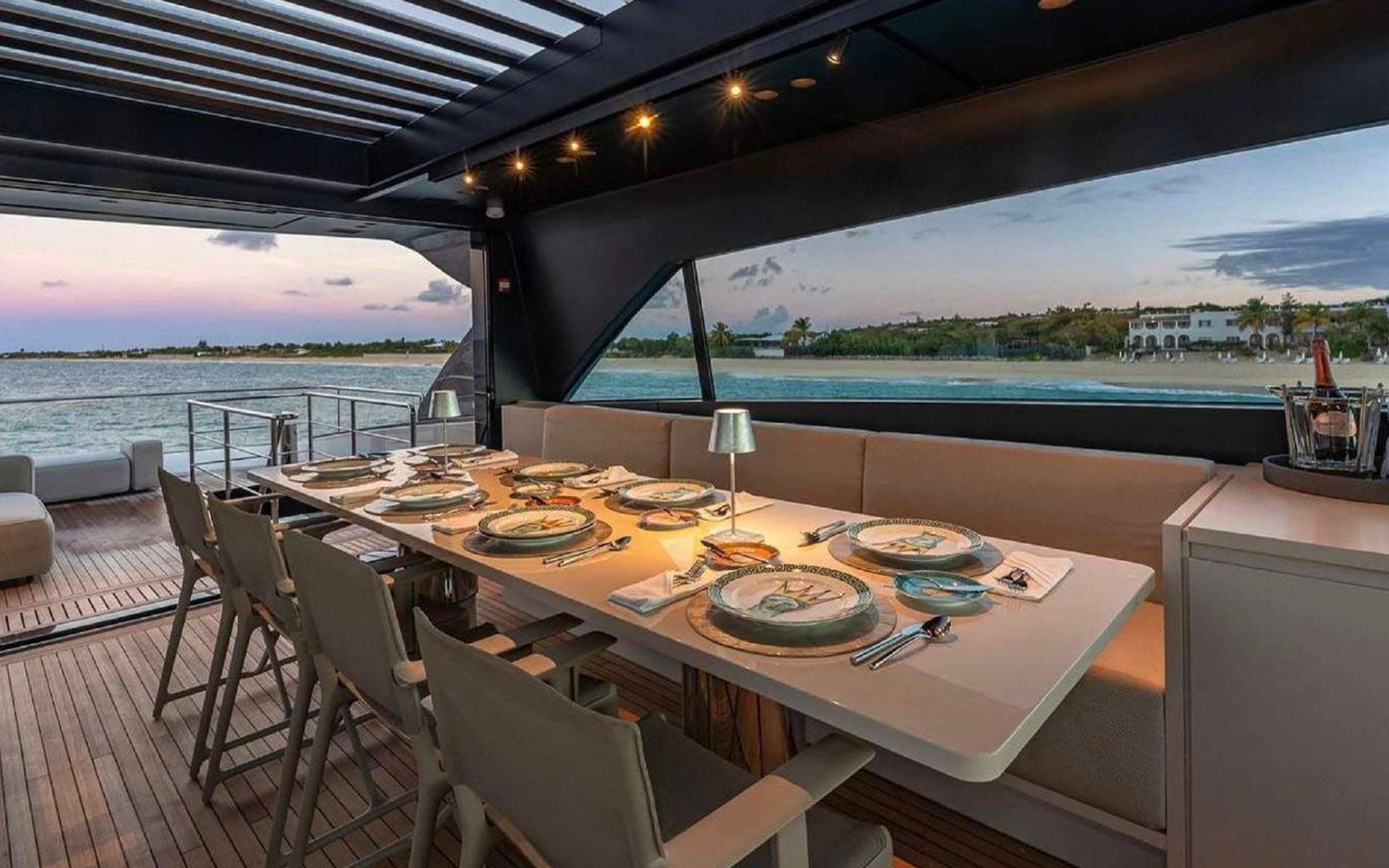 Alfresco dining table set for dinner aboard the 112' Sanlorenzo