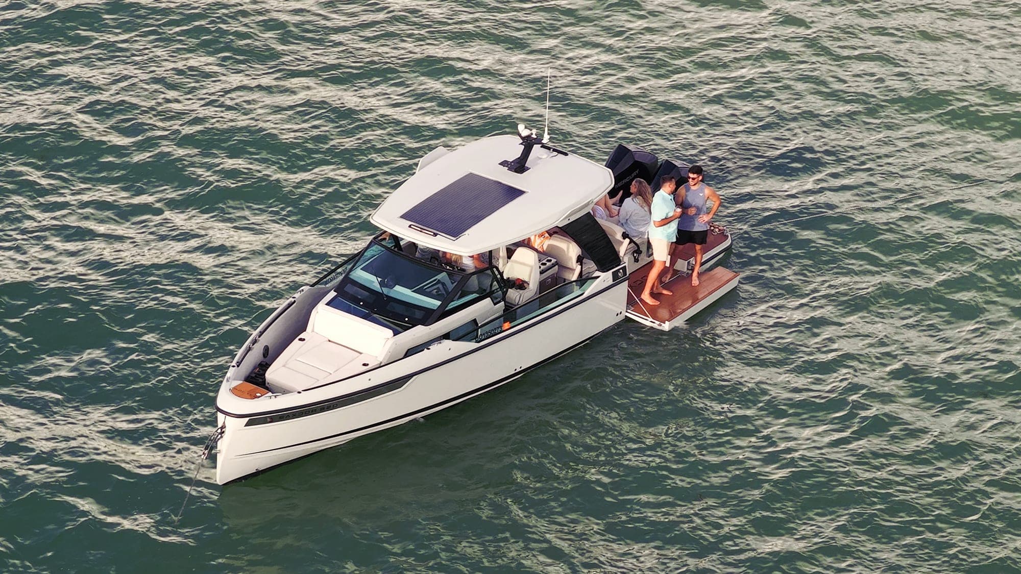 32' Saxdor day boat with guests aboard, Well Played Editions charter boat on Tampa Bay