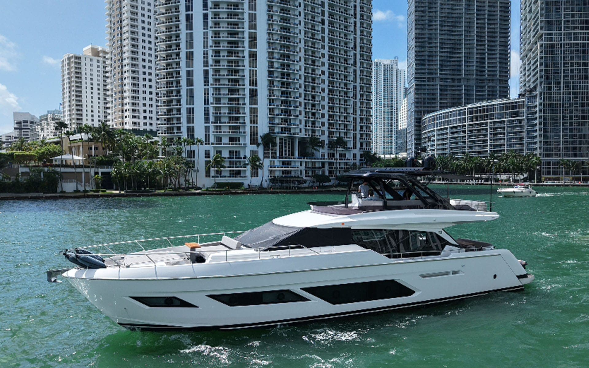 Profile of the 80' Ferretti in front of Brickell's towers