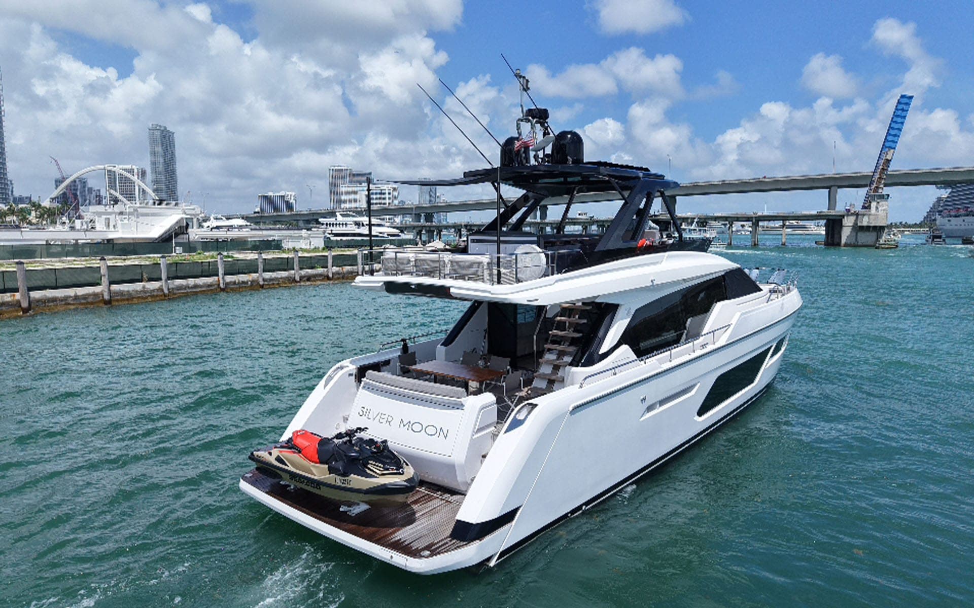 Stern and swim platform of the 80' Ferretti with a jet ski aboard