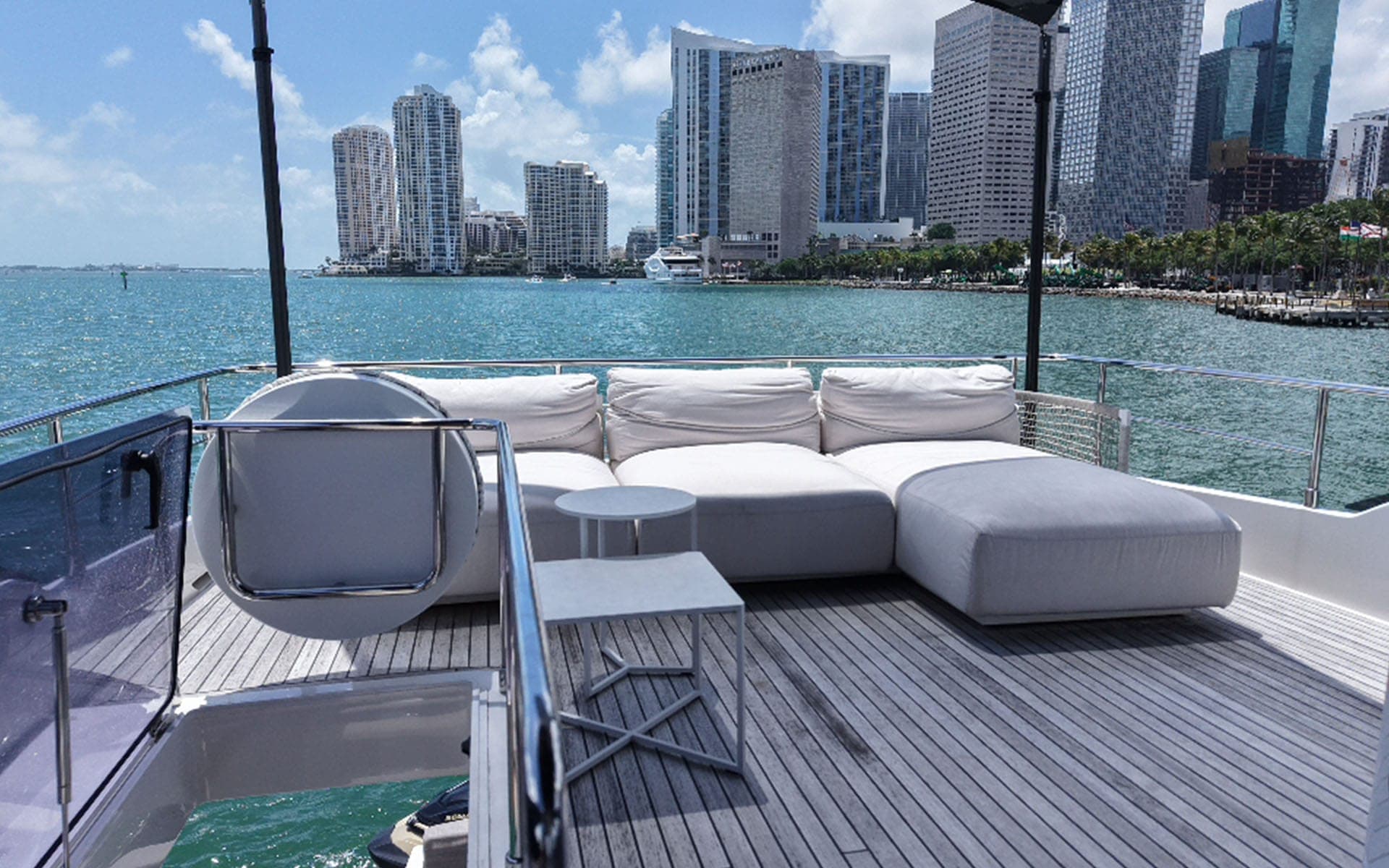 Flybridge lounge of the 80' Ferretti facing the Miami skyline