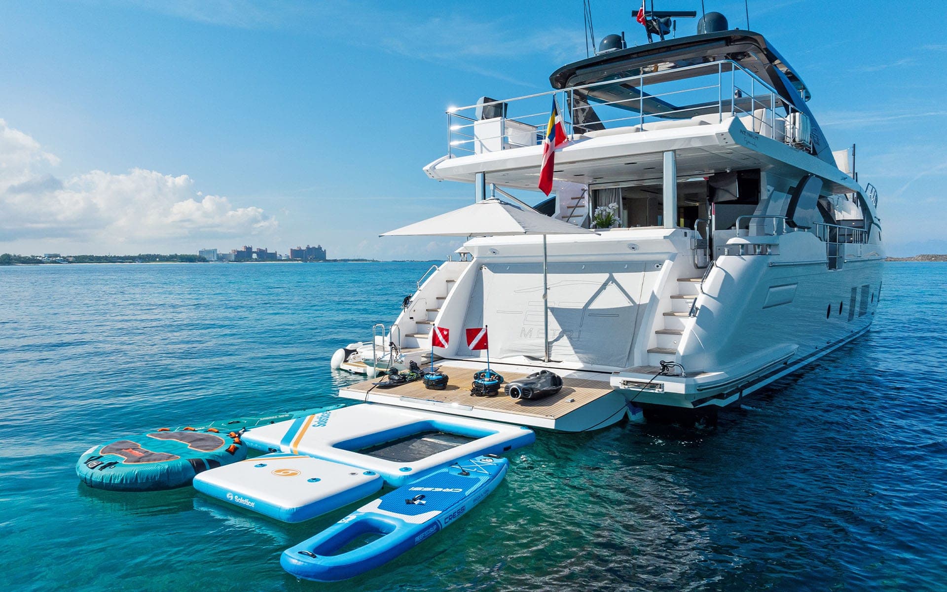 Swim platform and floating pool beside the 88' Azimut