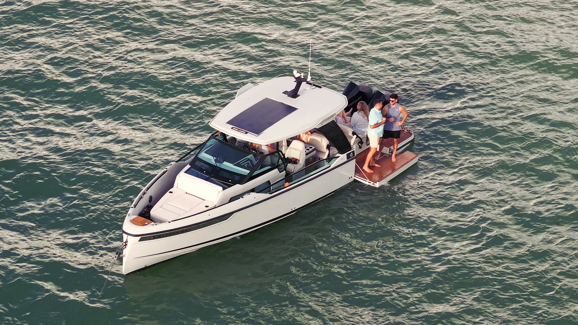 Saxdor day boat from above, guests on the swim terrace on Tampa Bay